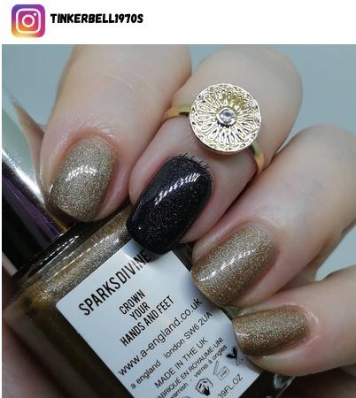 black and gold nail polish design