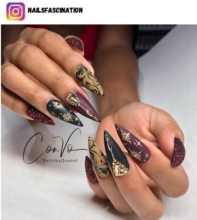 black and gold nail polish design
