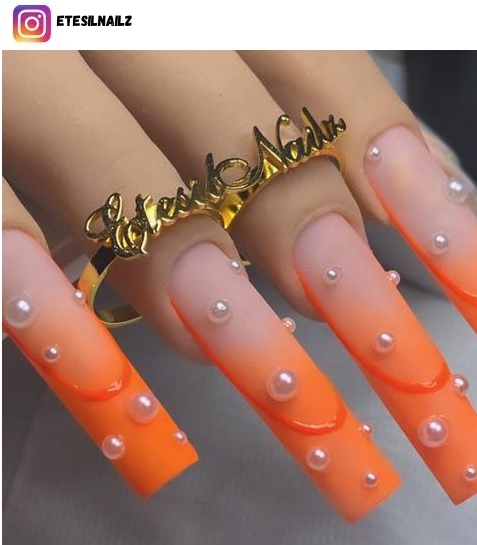 coffin orange nail design
