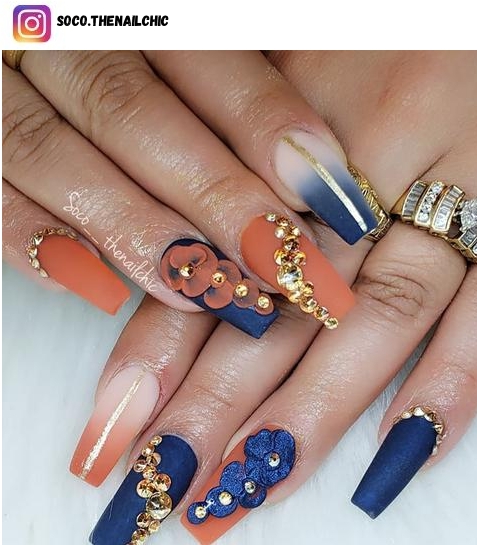 coffin orange nail design